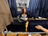 Sandra Brito matches the tops with the corresponding pants before the complete suit is shipped out at the Joseph Abboud manufacturing plant in New Bedford, MA.   [ PETER PEREIRA/THE STANDARD-TIMES/SCMG ]